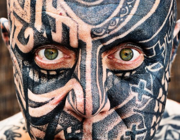 Compulsive tattoo addict Keith Gordon at home in Romford, Essex, 28th June, 2014.