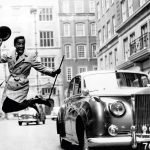 Entertainer Sammy Davis Jnr. with hired Rolls Royce motor car in 1963