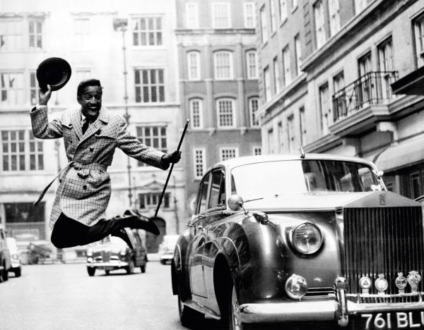 Entertainer Sammy Davis Jnr. with hired Rolls Royce motor car in 1963