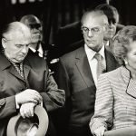 Mikhail Gorbachev checks his watch