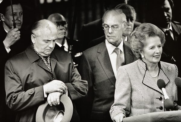 Mikhail Gorbachev checks his watch