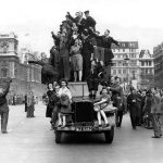 London May 8th 1945 Northcliffe Collection Study these faces closely and you can see the joy, the relief, the exuberance, the hope for the future that was brought about on May 8th 1945. Thousands of people gathered in London, and crowds of around 50,000 brought the traffic around Piccadilly Circus to a standstill . This is one of the hundreds of images in the Northcliffe Archive taken on the day by photographers from the Daily Mail. Sadly, recording which of the many photographers who were on duty that day for the Daily Mail was not one of the priorities so we are unable to say who took this photograph.