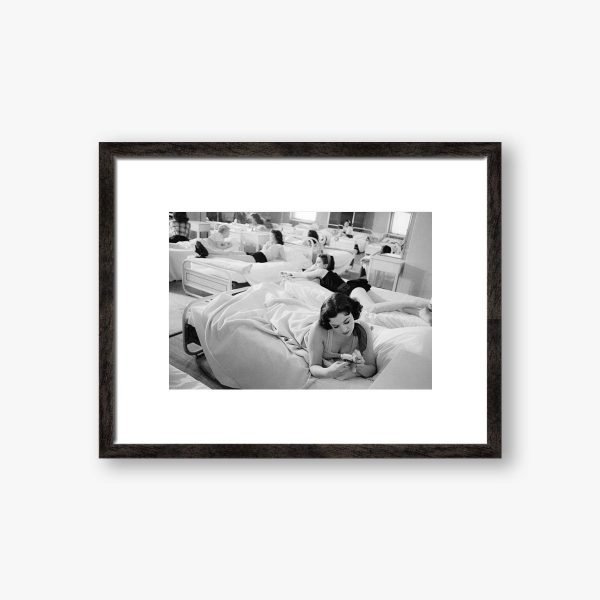 a small black and white framed photograph of the us dancers the Rockettes